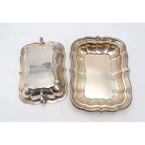 2534 - AN AMERICAN SILVER TUREEN AND COVERby Reed & Barton, of lobed rectangular form, with twin double... 