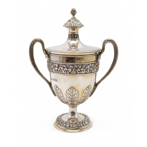 2535 - AN EDWARDIAN SILVER GILT TROPHY CUP AND COVERby James & William Deakin, London 1908, with a case... 