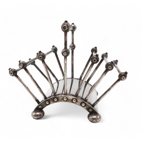 2536 - CHRISTOPHER DRESSER FOR HUKIN & HEATH;an electroplated six division folding toast rack, with bal... 