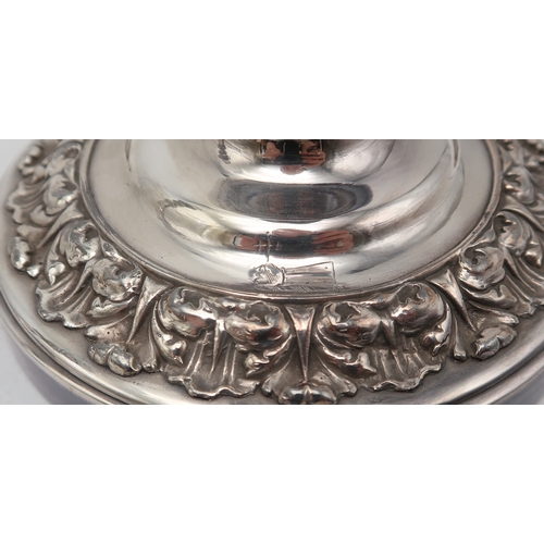 2537 - A PAIR OF SILVER PLATED HURRICANE LAMPSof cylindrical form, with cast foliate banding, with a knoppe... 