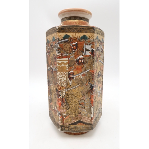 2429 - A SATSUMA HEXAGONAL VASE Painted with a continuous scene of samurai, beneath gilt mons, signed, 25.5... 