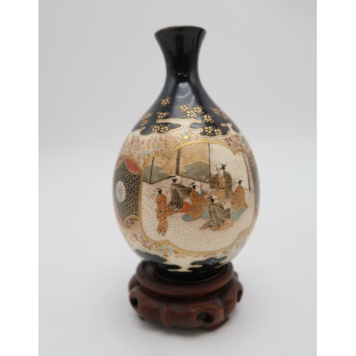 2433 - FOUR SATSUMA VASES A cylindrical vase with a mountainous landscape, signed, 15cm high, twin panel va... 