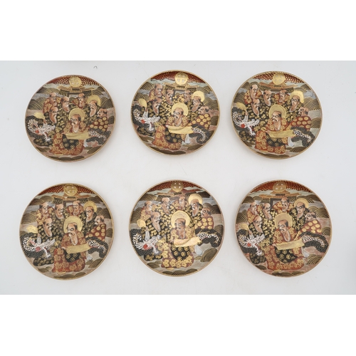 2437 - A SATSUMA TEA SERVICE Painted and moulded with dragons and Gods, comprising; teapot, sugar bowl, cre... 