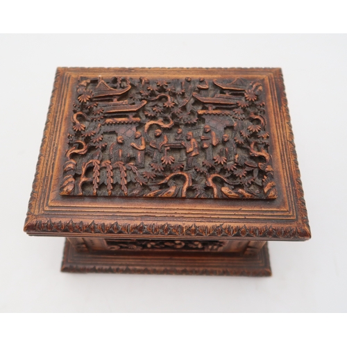 2448 - A CHINESE EXPORT SANDLEWOOD JEWELLERY BOX Carved with panels of figures amongst pavilions and trees,... 