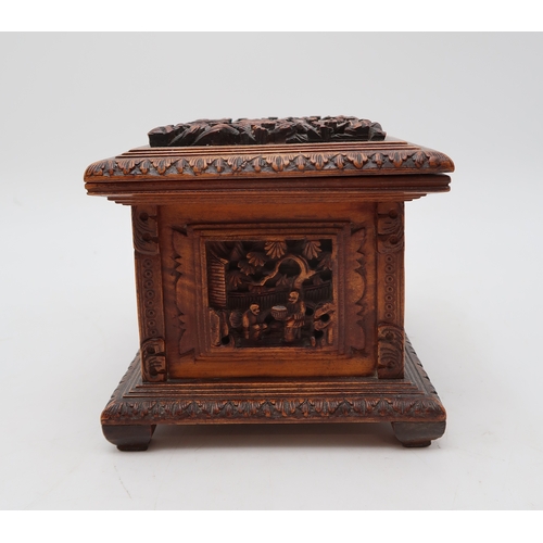 2448 - A CHINESE EXPORT SANDLEWOOD JEWELLERY BOX Carved with panels of figures amongst pavilions and trees,... 