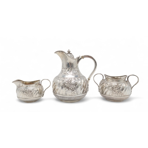 2546 - A LATE-VICTORIAN THREE PIECE SILVER TEA SERVICEby Martin Hall & Co, Sheffield 1901, of swollen b... 