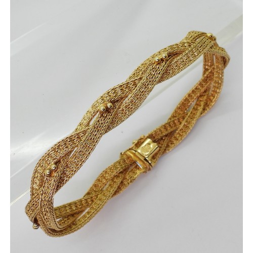 2738 - A WOVEN CHAIN BRACELETmade in bright yellow metal stamped 750 ASIAGOLD. Length 19.5cm, weight 20.2gm... 