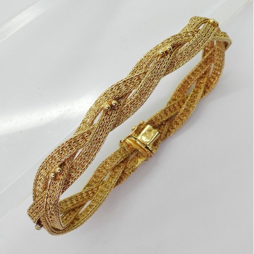 2738 - A WOVEN CHAIN BRACELETmade in bright yellow metal stamped 750 ASIAGOLD. Length 19.5cm, weight 20.2gm... 