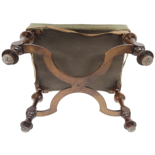 2030 - A 19TH CENTURY WALNUT FRAMED FOOTSTOOL with green upholstered top on turned baluster supports j... 