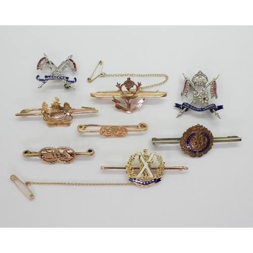 2616 - A COLLECTION OF SWEETHEART BROOCHES & CLAN BADGESa 9ct rose gold Seaforth Highlanders brooch, en... 