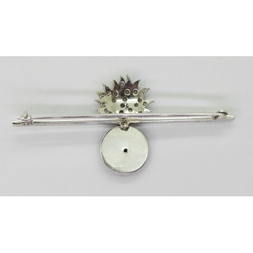 2617 - A ROYAL WELCH FUSILIERSbrooch in 18ct and 14ct white gold, the flames are set with rose cut diamonds... 