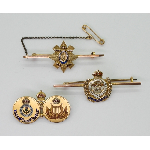 2618 - THREE MILITARY BROOCHESa 15ct gold brooch with champleve enamelled crest of the Royal Scots Fusilier... 