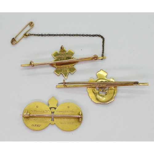 2618 - THREE MILITARY BROOCHESa 15ct gold brooch with champleve enamelled crest of the Royal Scots Fusilier... 