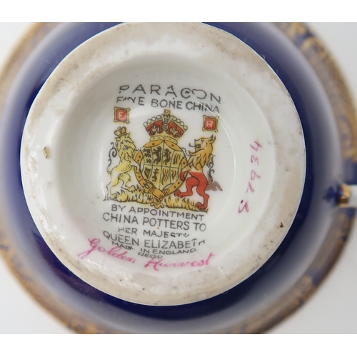 2259 - PARAGON GOLDEN HARVEST TEA WARES including four saucers and five cups, all cups signed by A Hol... 