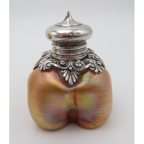 2260 - LOUIS COMFORT TIFFANY (AMERICAN, 1848-1933)An iridescent silver mounted scent bottle, an iridescent ... 