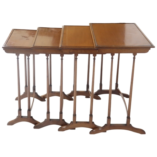 2041 - A LATE 19TH/EARLY 20TH CENTURY REGENCY STYLE NEST OF FOUR TABLES with rectangular beaded tops o... 