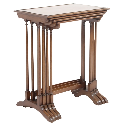 2041 - A LATE 19TH/EARLY 20TH CENTURY REGENCY STYLE NEST OF FOUR TABLES with rectangular beaded tops o... 