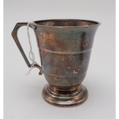 359 - A silver Christening cup, by Joseph Gloster Ltd, two silver spoons, and a white metal mounted golf b... 