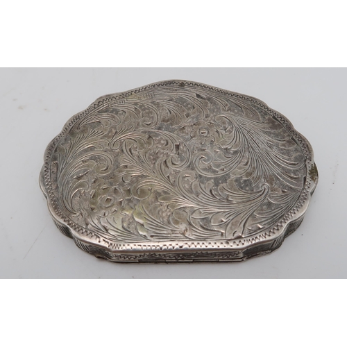 370 - An Italian silver and enamel powder compact, of shaped form, decorated with a courting scene, surrou... 