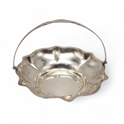 373 - A silver swing-handled basket, by Cooper Brothers & Sons, Sheffield 1916, of lobed form, 363gms