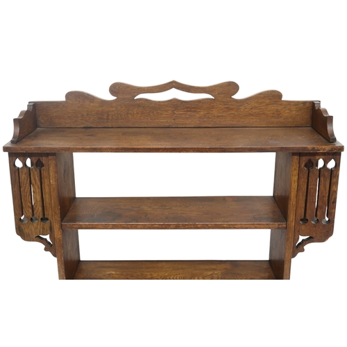 2043 - A LATE 19TH CENTURY OAK ARTS & CRAFTS OPEN BOOKCASE with pierced shaped gallery top over fo... 