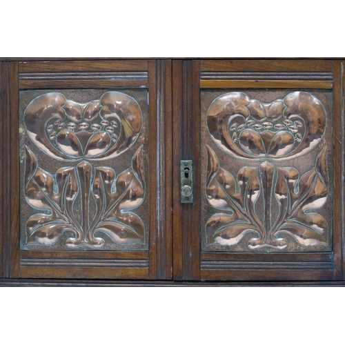 2044 - A LATE 19TH CENTURY ASH ARTS & CRAFTS SMOKERS CABINET with pair of panel doors with hammere... 