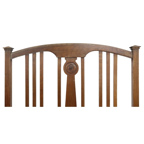 2046 - AN EARLY 20TH CENTURY MAHOGANY SINGLE HEAD AND FOOTBOARD each with arched slatted back with cen... 