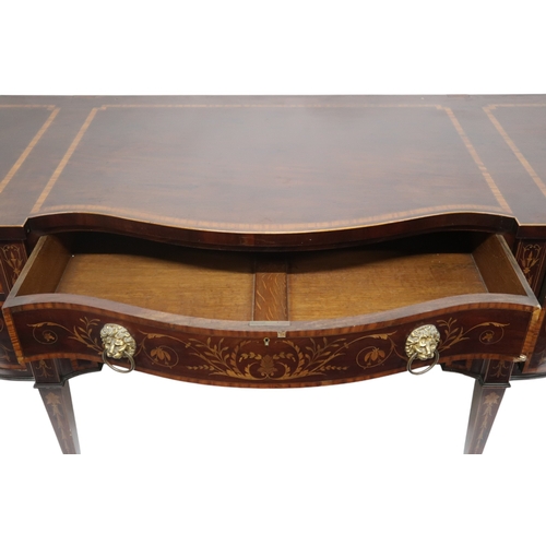 2055 - A GEORGIAN MAHOGANY AND CROSSBAND INLAID SERPENTINE FRONT SIDEBOARD with long central drawer over pa... 