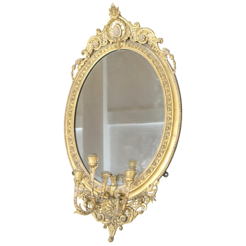 2056 - A 19TH CENTURY GILT ROCOCO OVAL GIRANDOLE WALL MIRROR with scrolling pierced surmount over oval... 