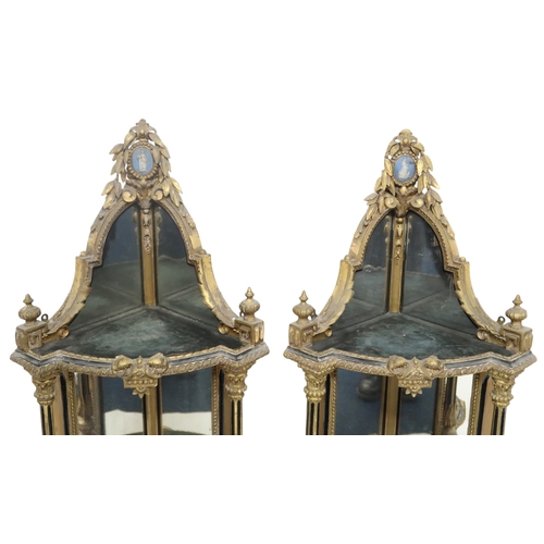 2057 - A PAIR OF 19TH CENTURY LOUIS XV STYLE GILT GESSO MIRROR BACKED CORNER WHAT-NOTSeach capped with cera... 