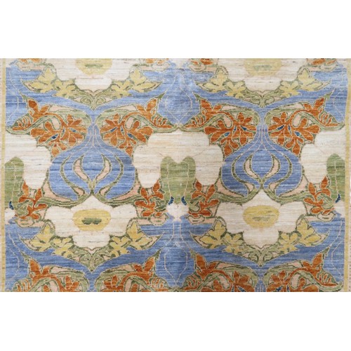 2156 - A LIGHT BLUE WILLIAM MORRIS STYLE RUG with multicoloured floral patterned design within floral ... 