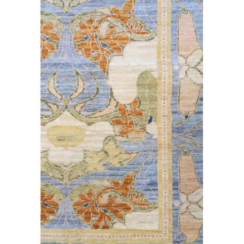 2156 - A LIGHT BLUE WILLIAM MORRIS STYLE RUG with multicoloured floral patterned design within floral ... 