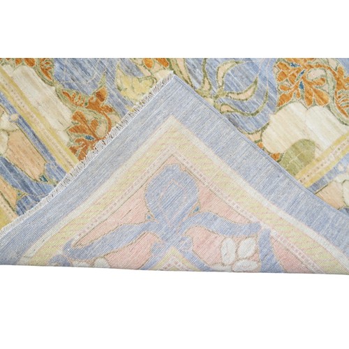 2156 - A LIGHT BLUE WILLIAM MORRIS STYLE RUG with multicoloured floral patterned design within floral ... 