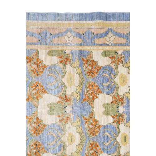 2156 - A LIGHT BLUE WILLIAM MORRIS STYLE RUG with multicoloured floral patterned design within floral ... 