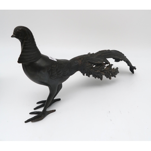 204 - A bronze sculpture of a pheasant, a spelter figure of Glory after Rousseau, a Sylvac black elephant ... 