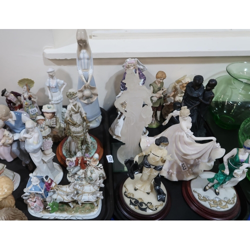 223 - A collection of porcelain figures by Leonardo, Nao etc and other resin figures