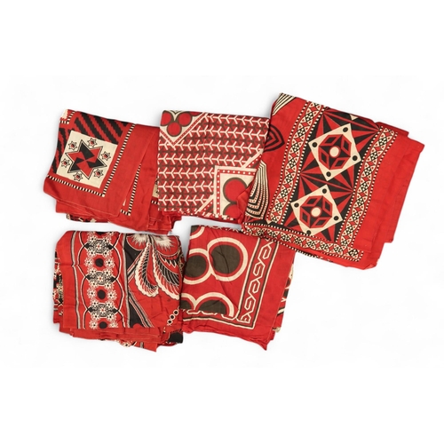 254 - Assorted printed fabrics in red, black and white, possibly African