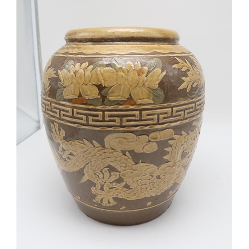 263 - A large Chinese stoneware jar, decorated with a dragon