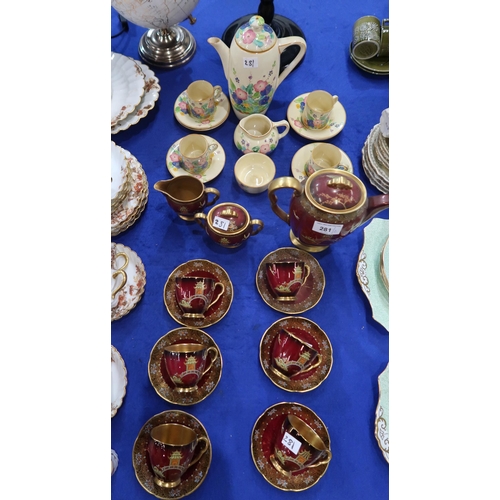 281 - A Susie Cooper for Gray's Pottery coffee set, painted with flowers comprising coffee pot, four cups,... 