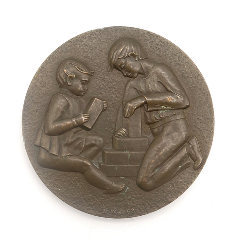 503 - A Society of Medallists bronze medal, the obverse cast with a depiction of children at play, the rev... 