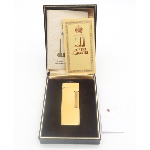 504 - A Dunhill yellow enamel Rollagas cigarette lighter, boxed, with accompanying paperwork and flint