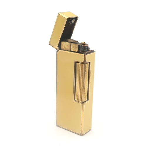 504 - A Dunhill yellow enamel Rollagas cigarette lighter, boxed, with accompanying paperwork and flint