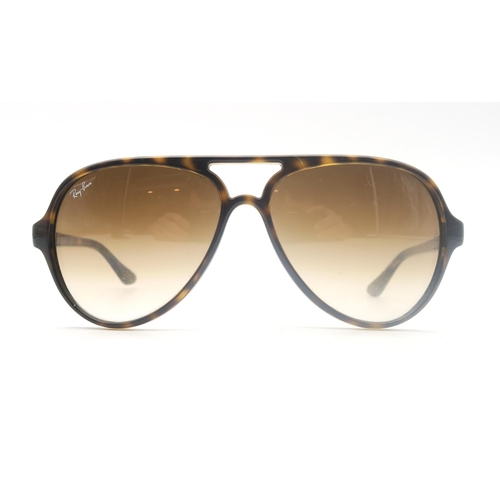 512 - Two pairs of vintage sunglasses marked 