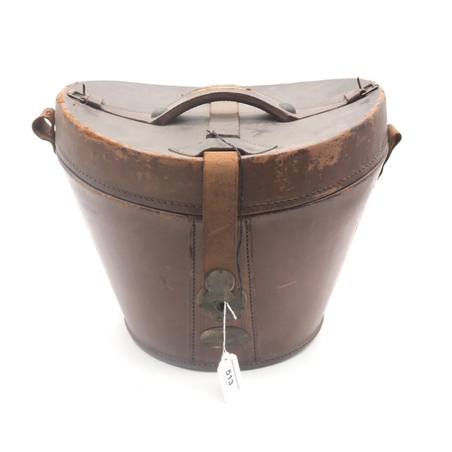 513 - A brown leather Gladstone bag, measuring approx. 46cm in length; together with a leather top hat cas... 