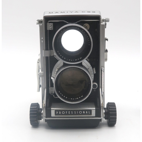 518 - A Mamiya C33 Twin Lens Reflex (TLR) medium format camera, fitted with Sekor 1:4.5 f=135mm lenses; a ... 