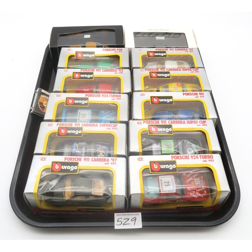 529 - A large collection of diecast model Porsche cars, to include 22 boxed Burago 1:43-scale examples, wi... 