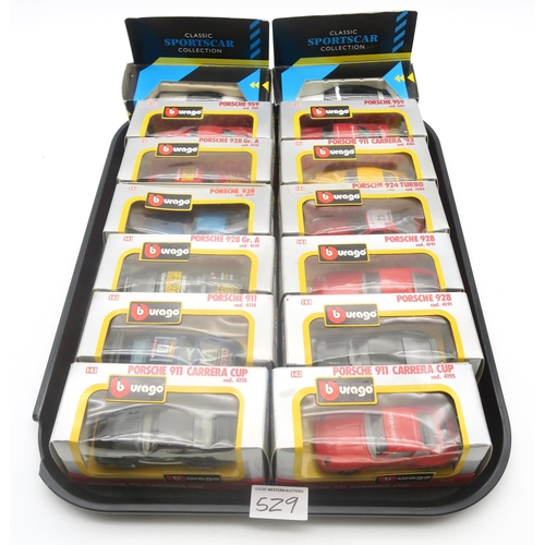 529 - A large collection of diecast model Porsche cars, to include 22 boxed Burago 1:43-scale examples, wi... 