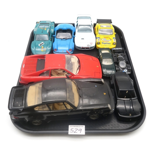 529 - A large collection of diecast model Porsche cars, to include 22 boxed Burago 1:43-scale examples, wi... 