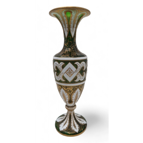 2263 - A PAIR OF BOHEMIAN WHITE OVERLAY GREEN GLASS VASESof typical urn shape, with painted gilt scrolling ... 