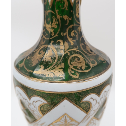 2263 - A PAIR OF BOHEMIAN WHITE OVERLAY GREEN GLASS VASESof typical urn shape, with painted gilt scrolling ... 